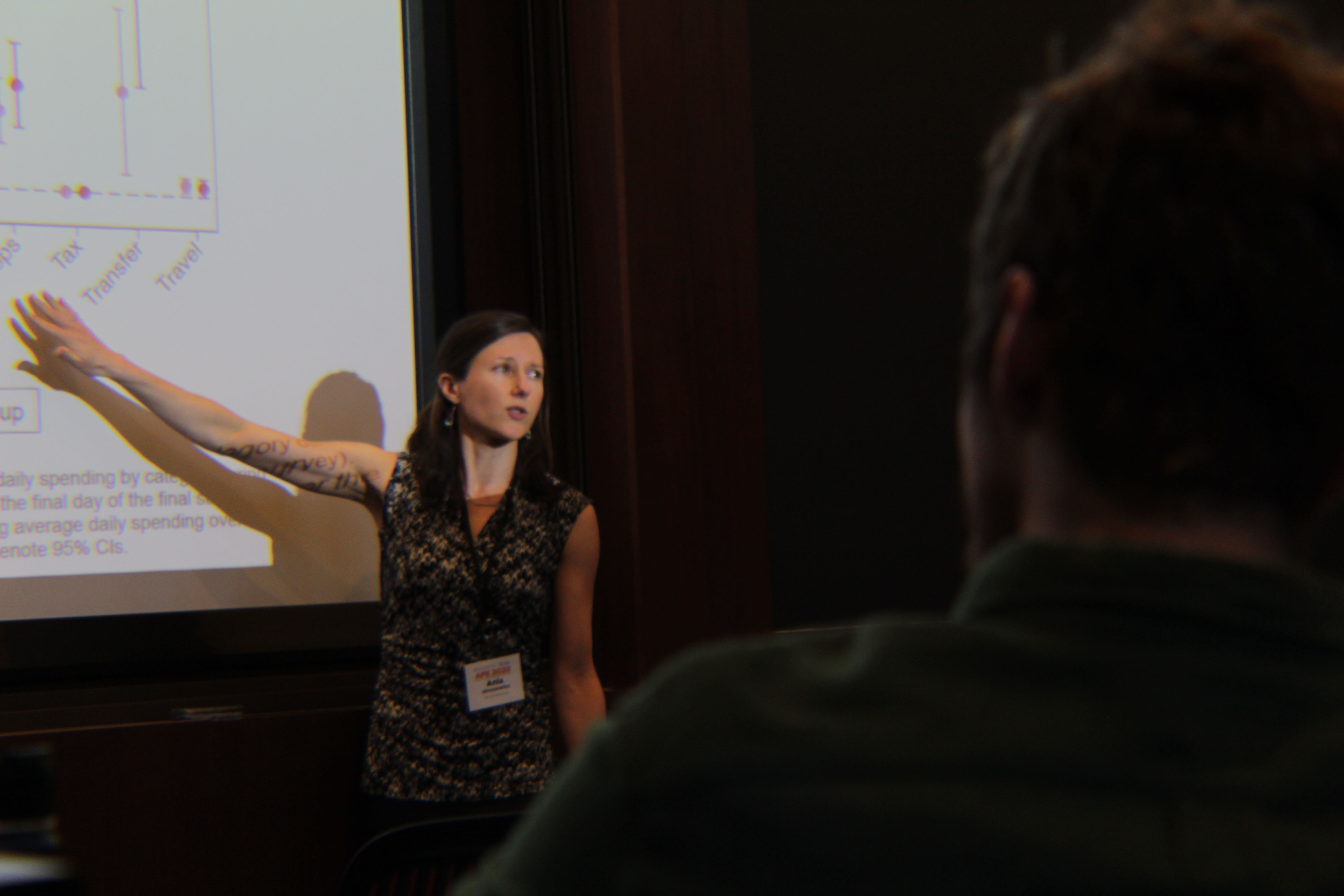 Woman presenting on a projector screen