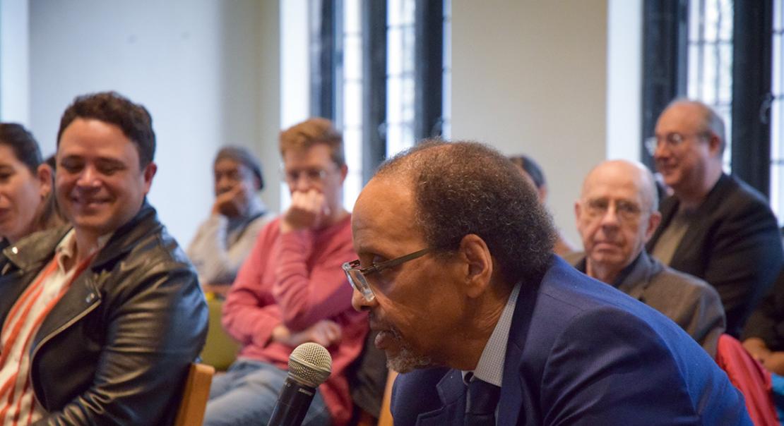 Michael Dawson answering a question while seated.